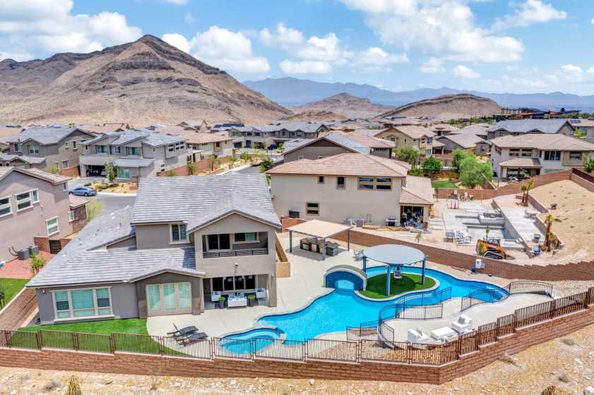 Drone photo of amazing backyard with pool and island